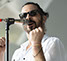 Master Photographer Ron Richman photographed these muscians and singers at the Concerts At Commons Beach. Close up of singer Hans. Joy & Madness