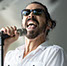 Master Photographer Ron Richman photographed these muscians and singers at the Concerts At Commons Beach. Close up of singer Hans. Joy & Madness